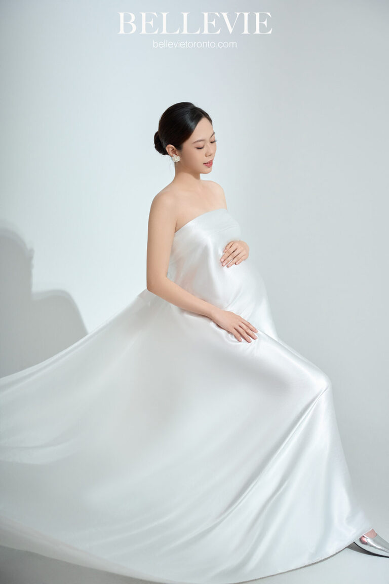 Artistic shot of a pregnant woman bathed in light